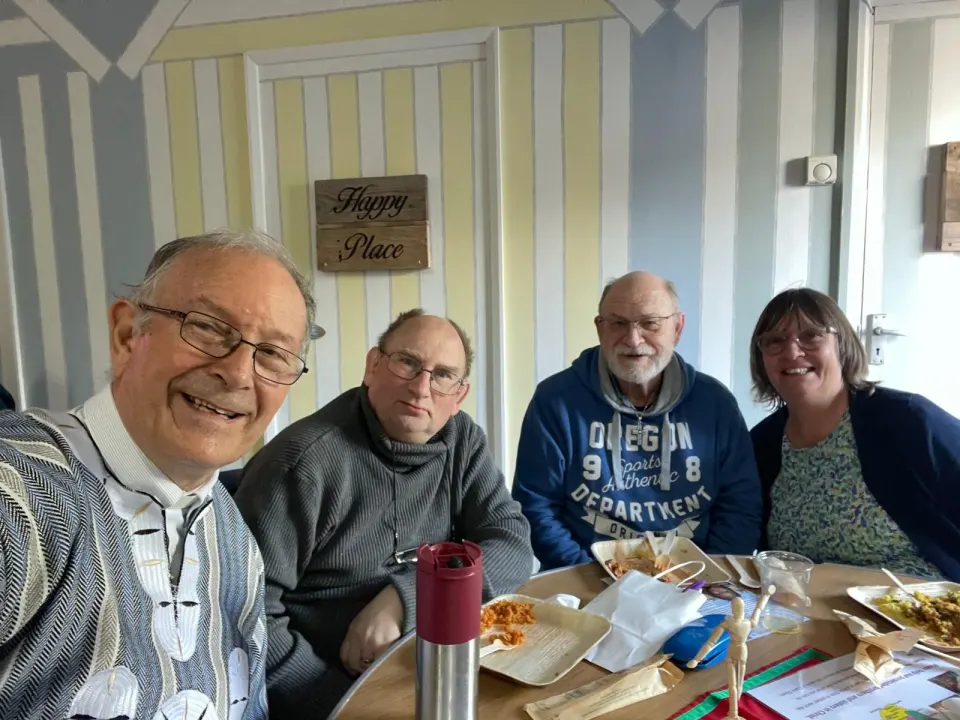 Smiles and conversation over the shared meal