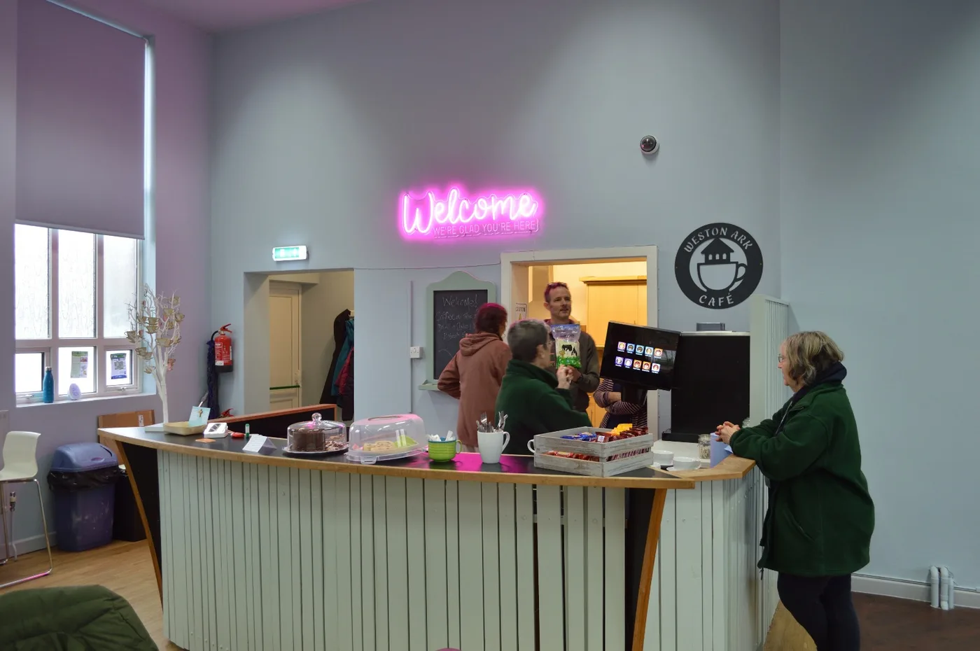 Volunteers at the café counter in January 2026, showing the café in use after its launch. Photograph by Tyler.