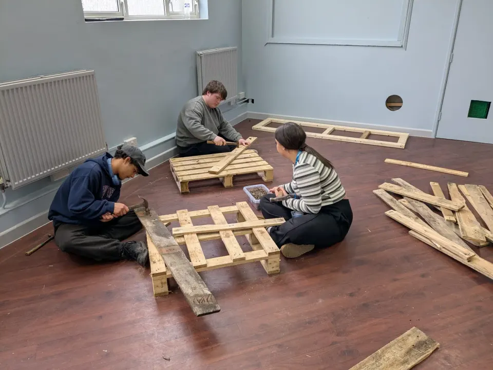 Working together on timber projects at the Hughenden Centre in February 2026.