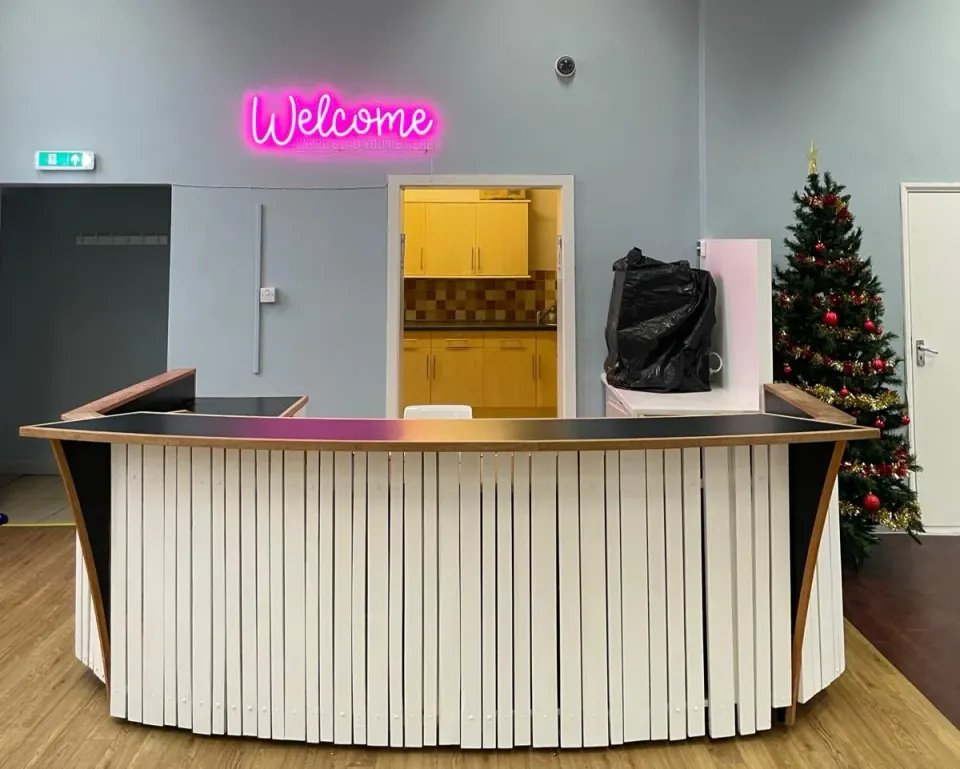 A small sign, a big message: you’re welcome here. Ark Café is getting ready.