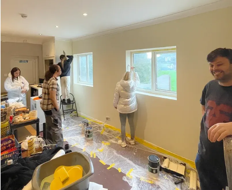 The learners at work painting the Foodbank Store at the Hughenden Centre.